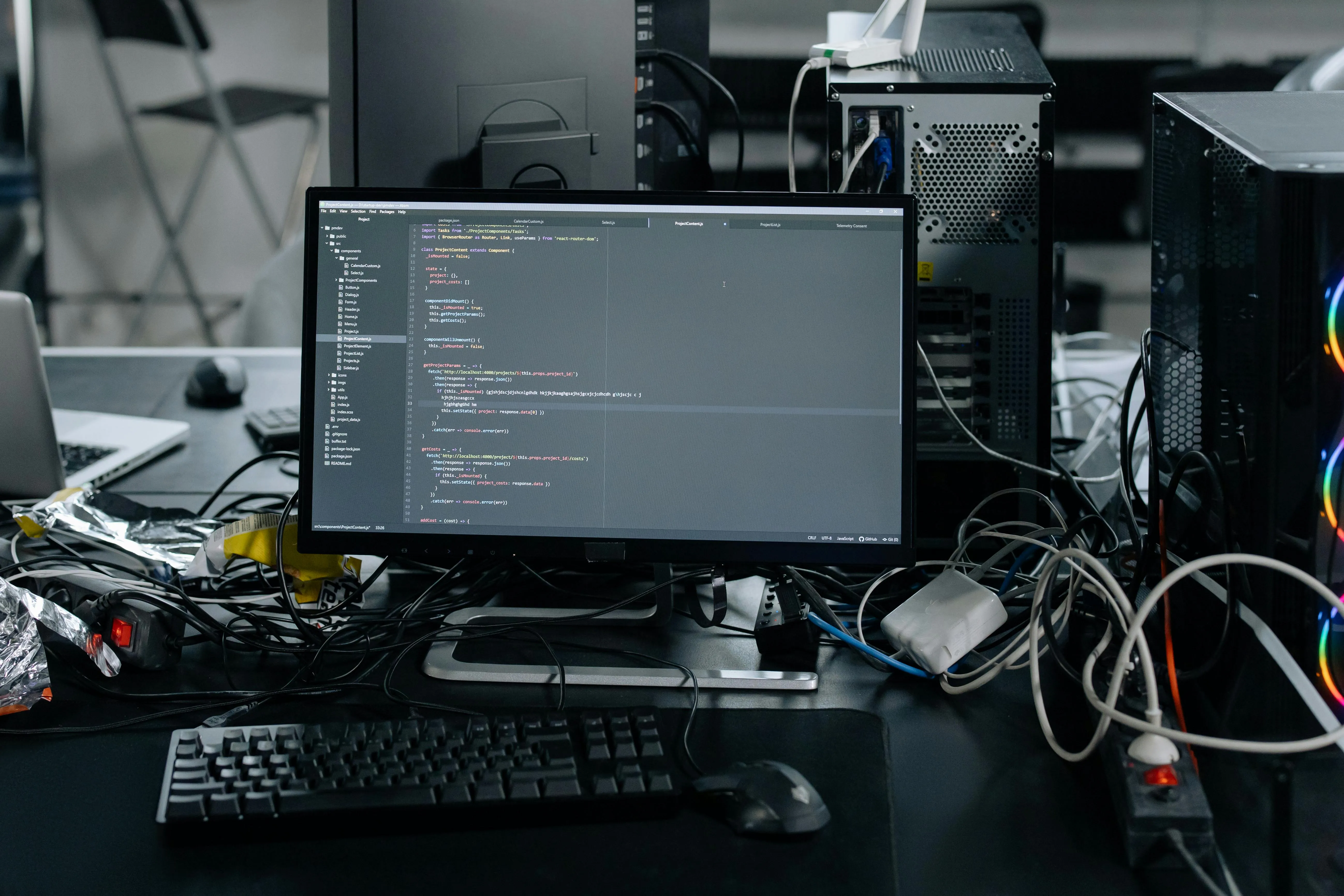 A computer surrounded by wires